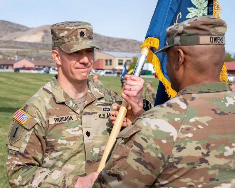 Lt. Col. Steven Pagoaga receives the battalion colors in the activation ceremony for the 1-204th Infantry Regiment.