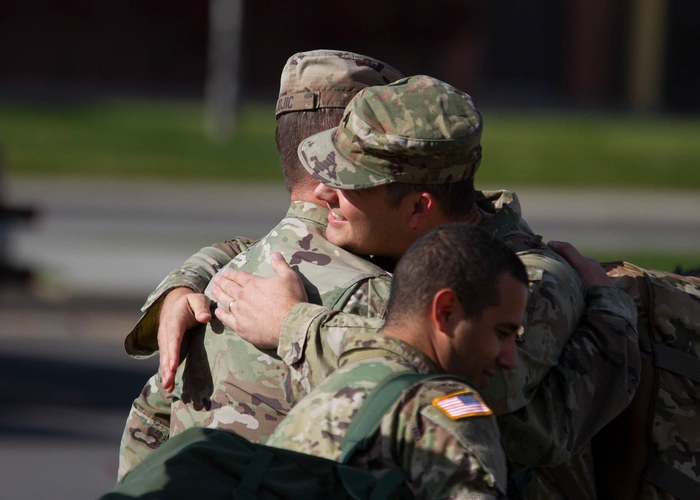 Soldiers hugging after returning home