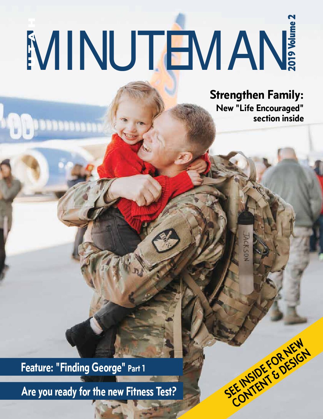 Male soldier from the 65th field artillery brigade wearing multi-camo combat uniform and bag holding a young girl who is wearing a red sweater and black jeans