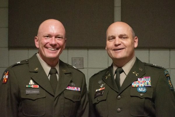 Two senior military officers pose for a photo