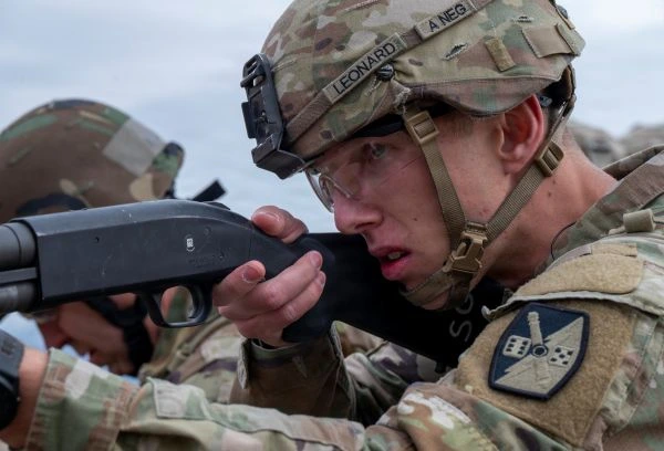 A soldier aims a rifle during a shooting competition