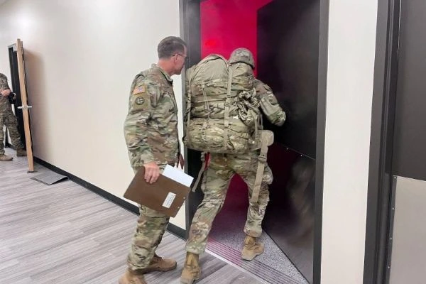looking ahead, soldiers going through a door