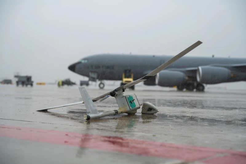 Destroyed drone in front of aircraft