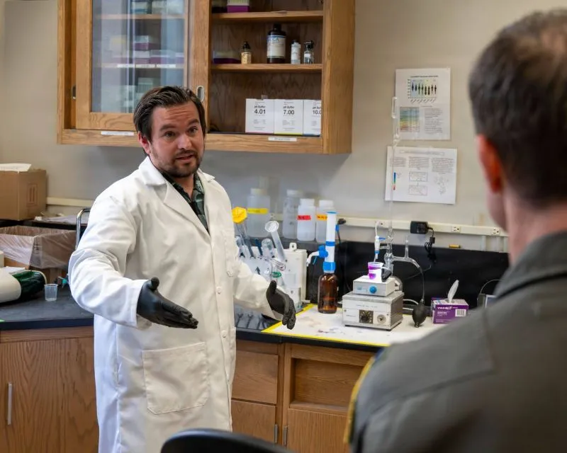 A technician explains a water treatment test