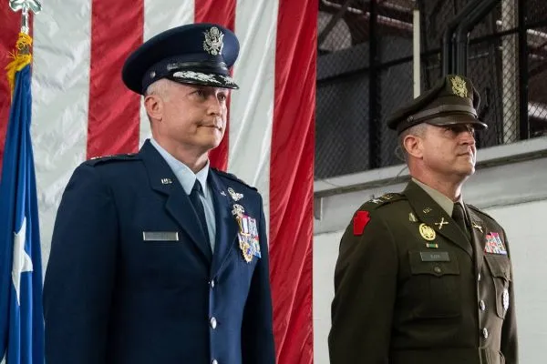 An Air Force officer and an Army officer stand at attention in dress uniforms.