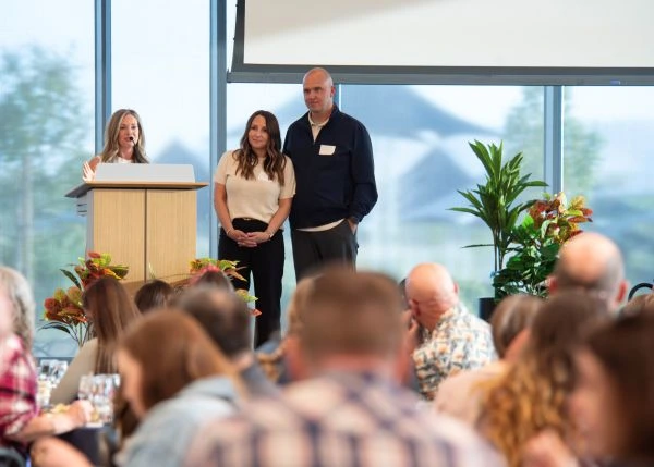 Event organizers address Utah National Guard spouses and family members during Spouse Night at the Zions Bancorporation Technology Center, April 24, 2026. The gathering highlighted family readiness resources, support programs and the importance of building connections across the Guard community.