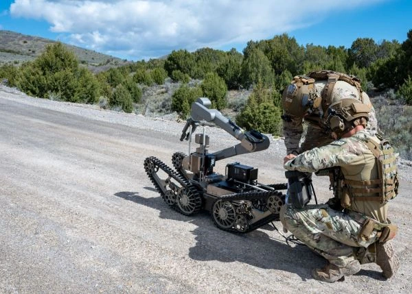 Airmen operate a tracked robot
