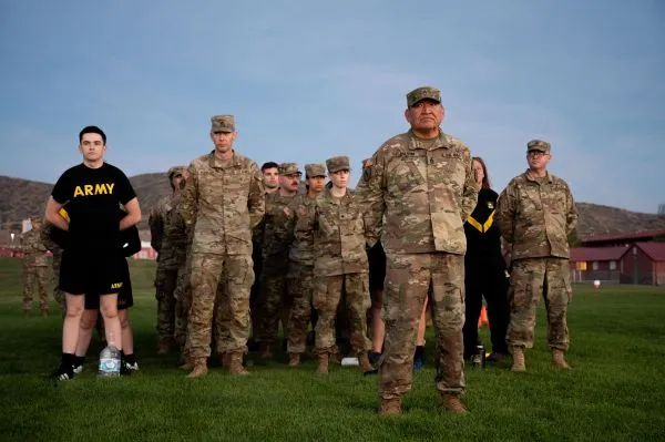 Formation of Utah National Guard Soldiers standing at attention on a grassy field