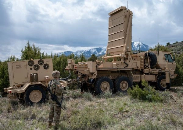 A Soldier watches a radar system on a military vehicle